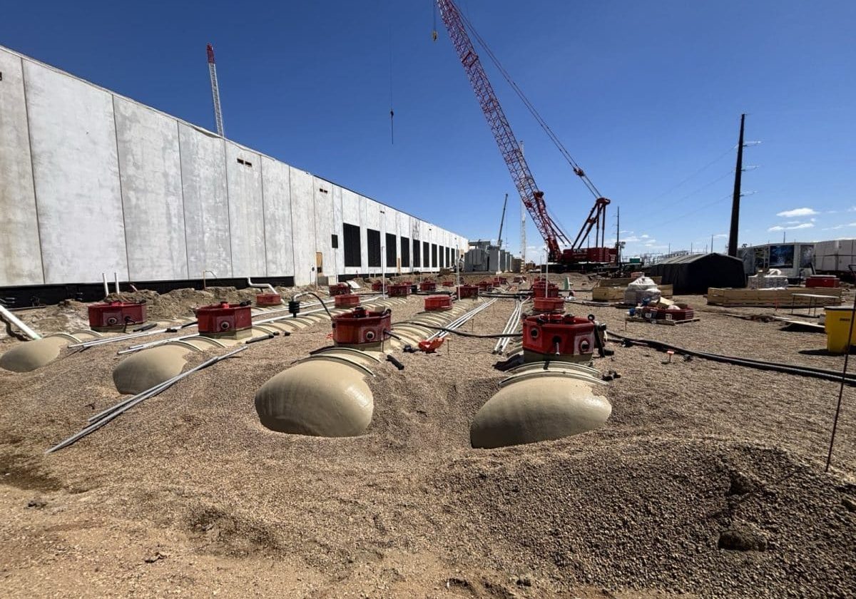 Fuel tanks being backfilled with containment sumps and risers installed at a data center site